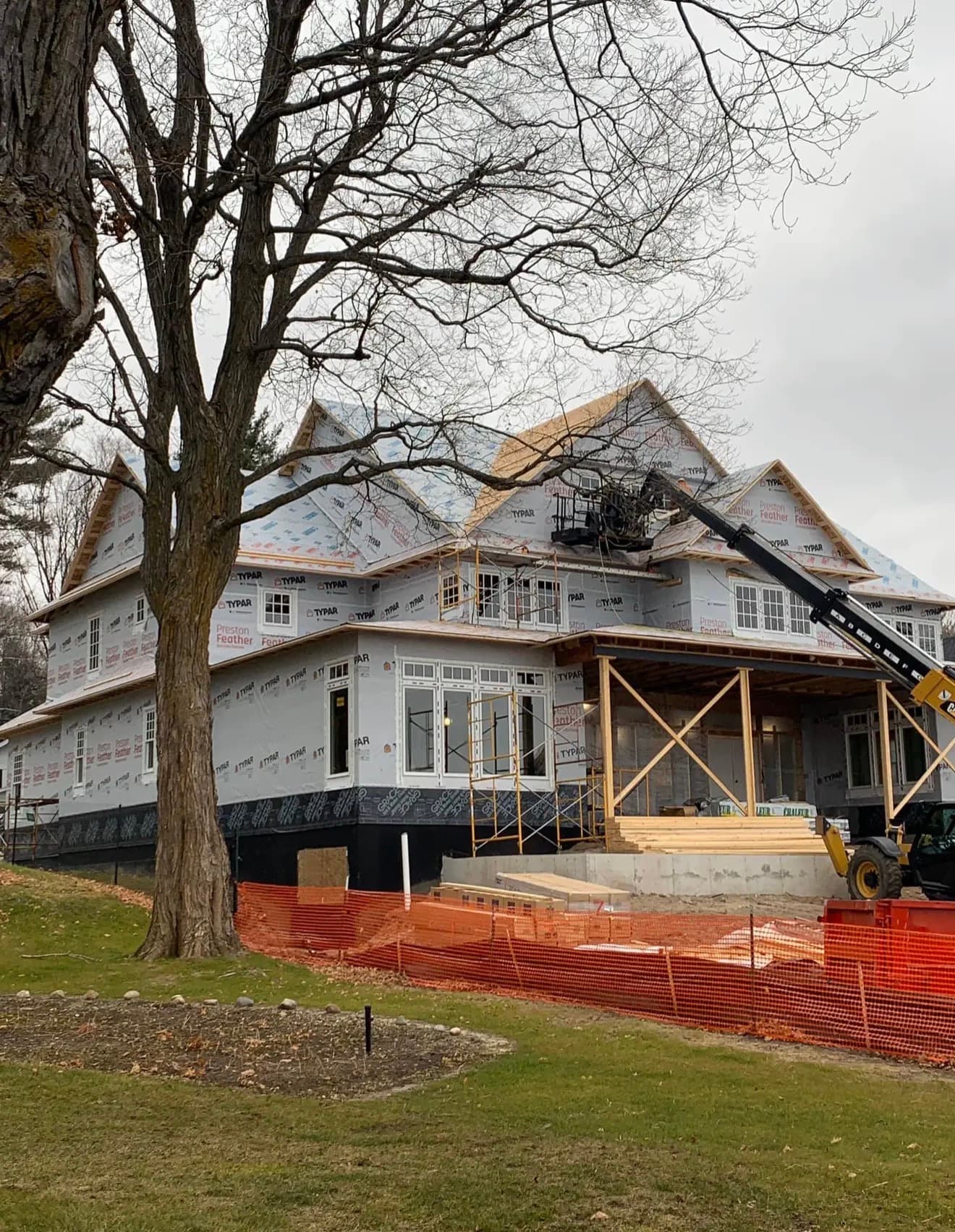 Completed Northern Michigan home with new architectural shingle roof seen from a distance